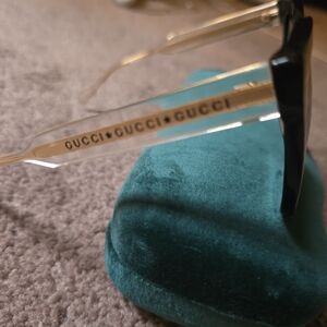 Gucci Clear Frame Sunglasses with Black Temples and Gold Accents